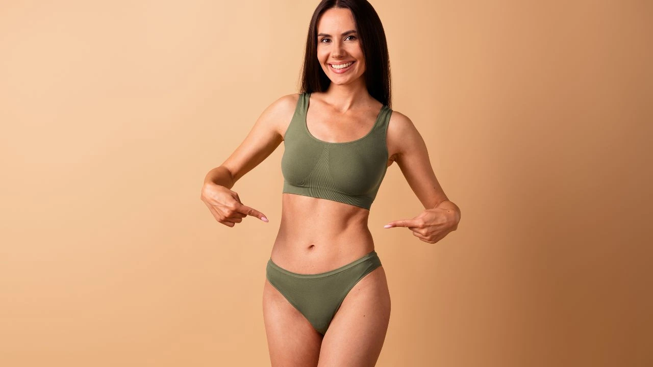 stunning woman showing thin waist abdominal muscles